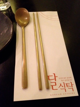 Korean food is served with chopsticks and long spoons as utensils